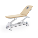 Stół do masażu i rehabilitacji Gymna.GO D1e w kolorze beżowym, z elektryczną regulacją wysokości.