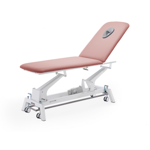Stół do masażu i rehabilitacji Gymna.GO Traction w kolorze różowym, z otworem na twarz.