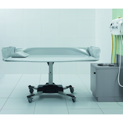 Wózek kąpielowo-transportowy w pozycji poziomej – ergonomiczne rozwiązanie do mycia pacjentów.